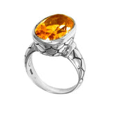 Handcrafted sterling silver ring with oval Citrine Quartz and artisan carved band, made in Bali.